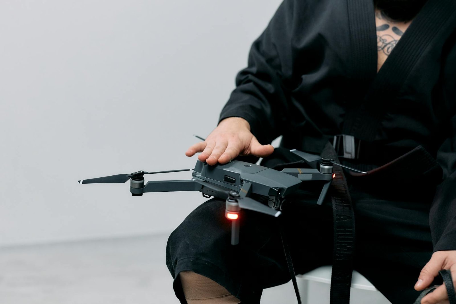 https://www.pexels.com/photo/photo-of-man-holding-drone-on-his-lap-8059122/